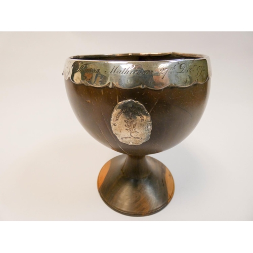 450 - An 18th century coconut cup, with silver rim and mount, inscribed Thomas Mathieson 27th December 179... 