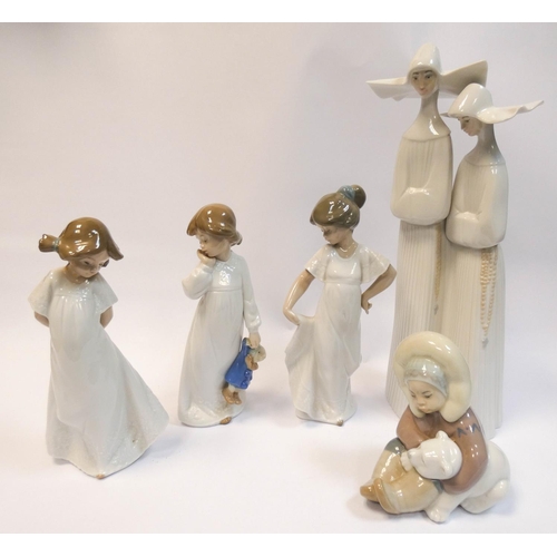 502 - Lladro - a  figure group of Nuns, an Eskimo and Polar bear cub figure and three Nao figures of girls... 