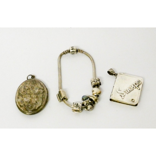 632 - A modern silver charm bracelet, stamp case and an oval silver locket