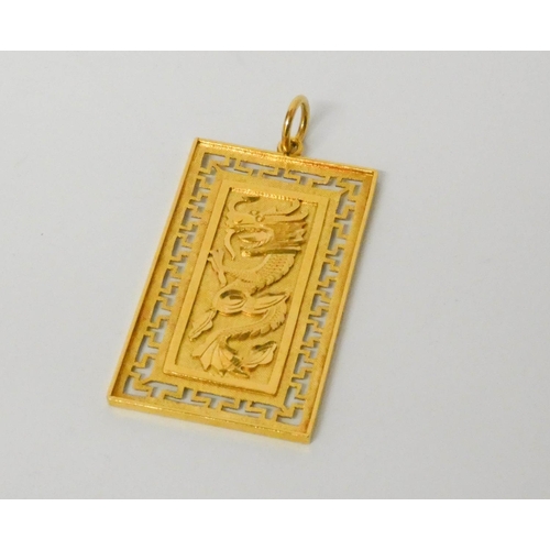 668 - A Chinese yellow gold rectangular panel pendant, 6 cms long, weight 21 grams. Marked 916.