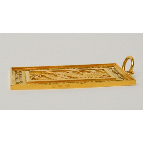 668 - A Chinese yellow gold rectangular panel pendant, 6 cms long, weight 21 grams. Marked 916.