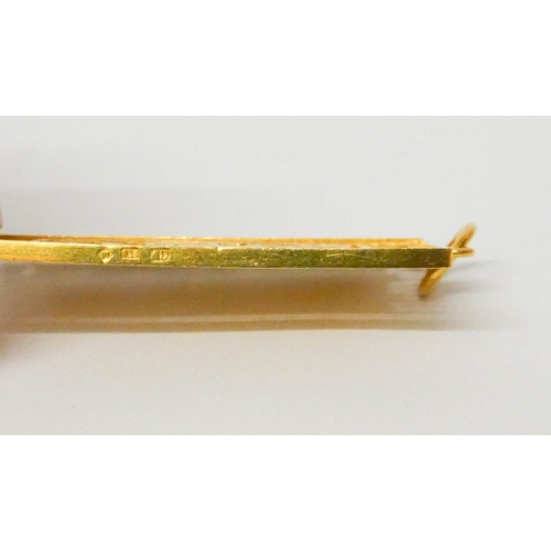 668 - A Chinese yellow gold rectangular panel pendant, 6 cms long, weight 21 grams. Marked 916.