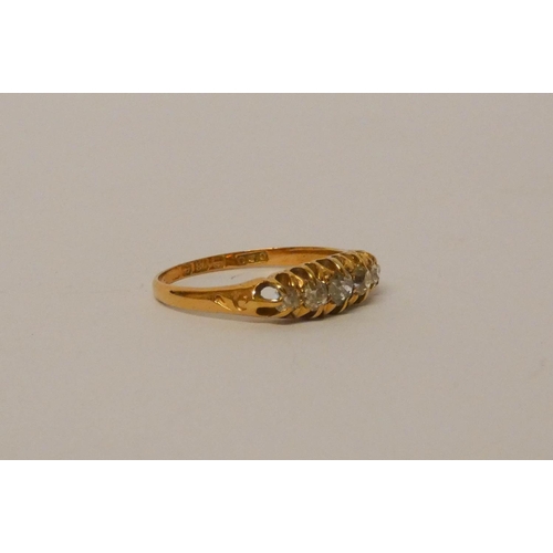 669 - 18ct gold five stone diamond ring, ring size R. 3.1 grams