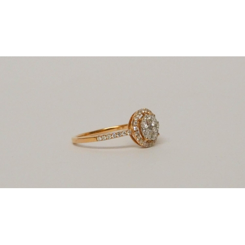 673 - 18ct rose gold diamond cluster ring, designed as a circular flower cluster within a halo style setti... 