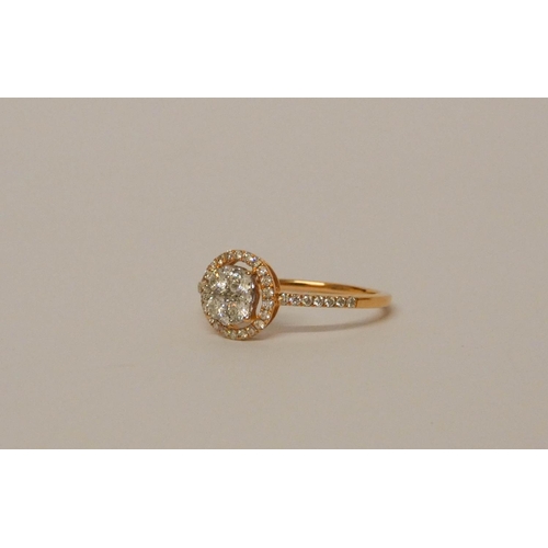 673 - 18ct rose gold diamond cluster ring, designed as a circular flower cluster within a halo style setti... 