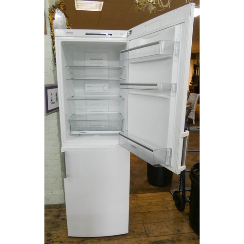 706 - A 6' tall Siemens half and half fridge freezer