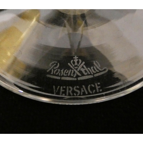 510 - Rosenthal for Versace a pair of Medusa head stemmed wine glasses with amber bowls