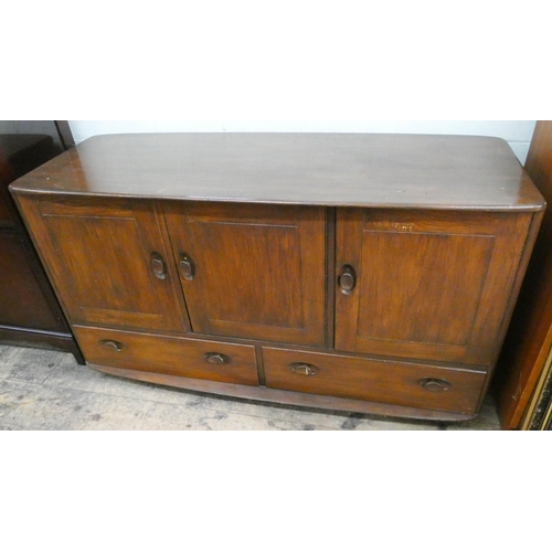 28 - An Ercol oak three door sideboard with two drawers under, 4'3 wide