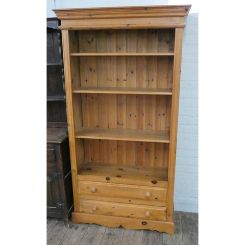 60 - A modern pine open bookcase with two long drawers under, 3' wide