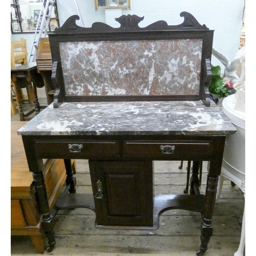 75 - An Edwardian walnut washstand with marble top and back, 3' wide