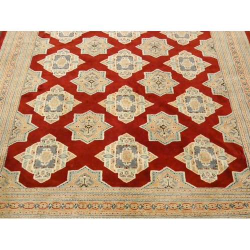 168 - A large Persian red and fawn silk pile rug, 10'6 x 8'3