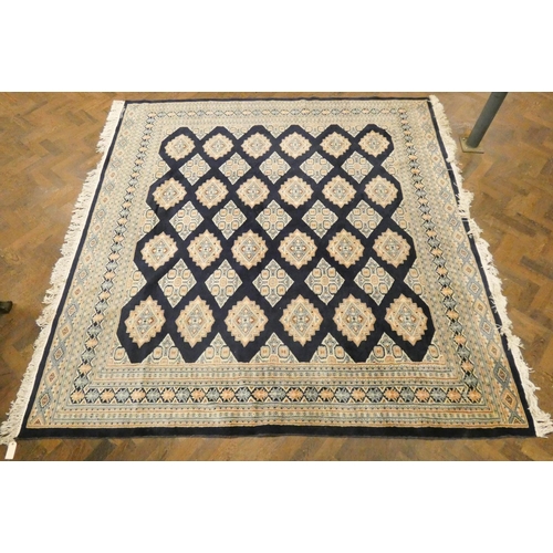 169 - A large blue and fawn pattern Persian style rug, 8'3 x 7'9