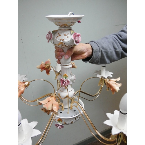 175 - A floral encrusted china and brass five branch chandelier