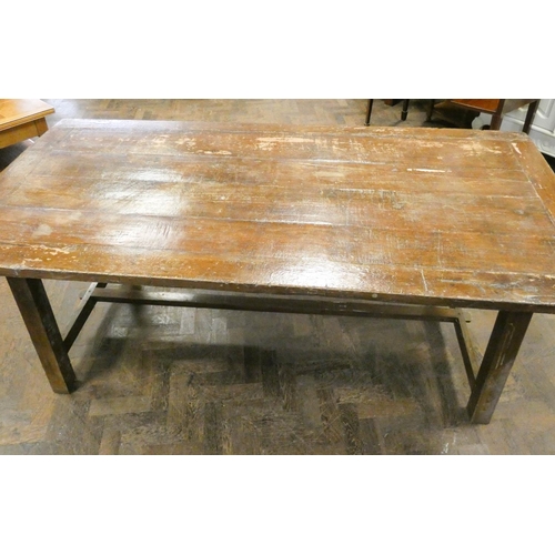 192 - A large rustic trestle style dining table on square legs, 79