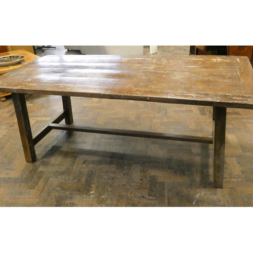 192 - A large rustic trestle style dining table on square legs, 79