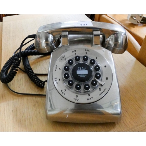 107 - A modern chrome dial telephone