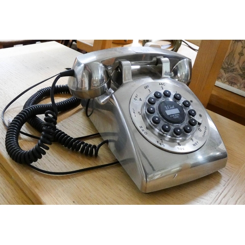 107 - A modern chrome dial telephone