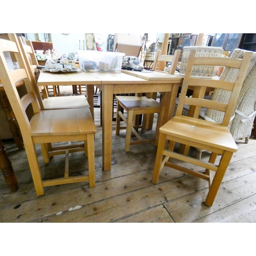 108 - A modern light oak fold over top dining table and four ladder back style chairs with panel seats