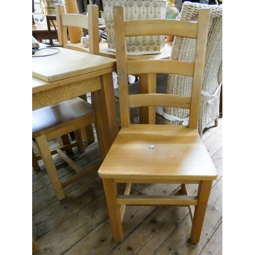 108 - A modern light oak fold over top dining table and four ladder back style chairs with panel seats