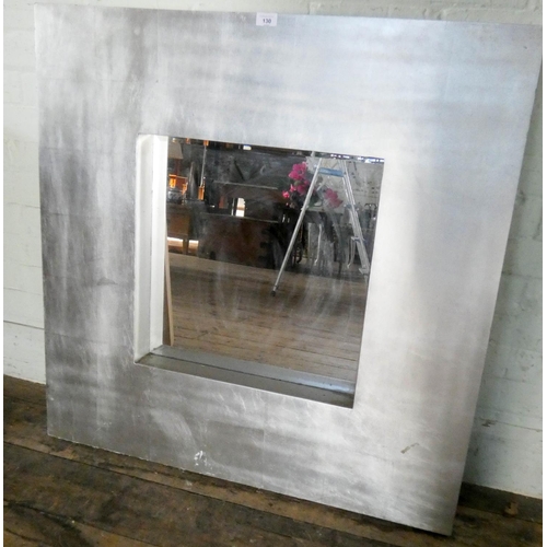 130 - A large contemporary wall mirror in wide silver frame and a large square print of a flower