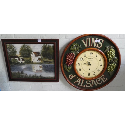 137 - A circular wall clock in a vine decorated frame and a framed oil painting