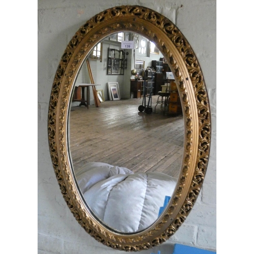 139 - An oval wall mirror in gilt frame