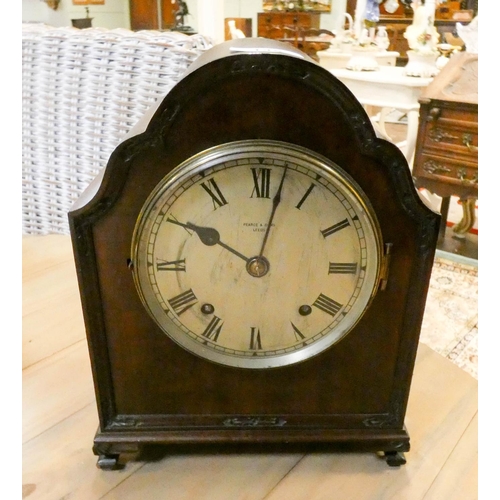 145 - A mahogany striking mantel clock by Pearce & Sons Leeds with balance escapement