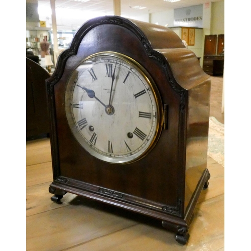 145 - A mahogany striking mantel clock by Pearce & Sons Leeds with balance escapement