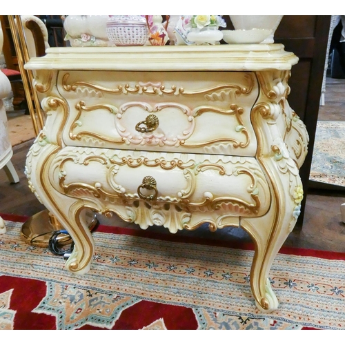 151 - An Italian cream, gilt and floral painted Bombe shaped chest of two drawers on cabriole legs, 2'3 wi... 