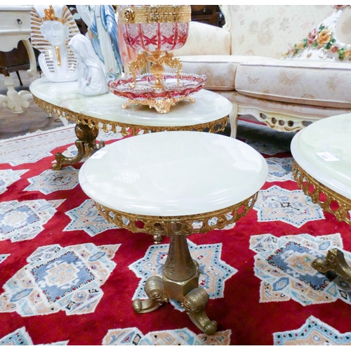 153 - A circular brass framed coffee table with pale green onyx top