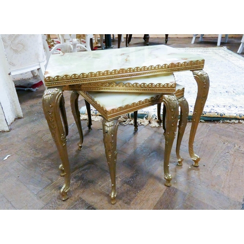 155 - A nest of three brass framed coffee tables with onyx tops