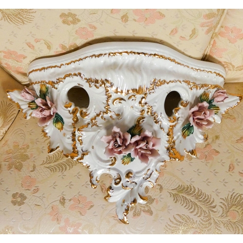 167 - A Capodimonte white gilt and floral encrusted china wall bracket and another similar wall bracket