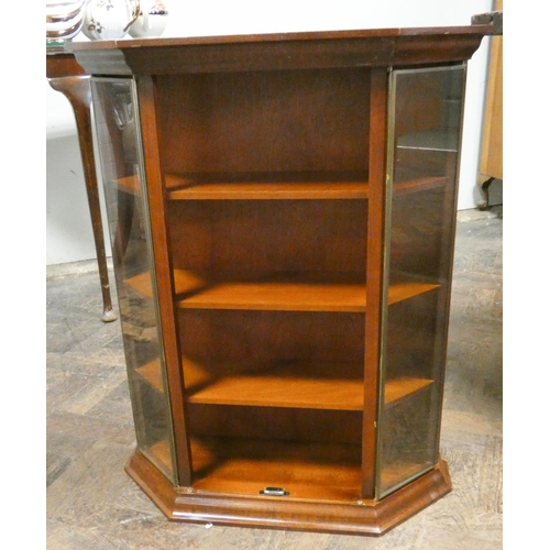 190 - A small shaped mahogany wall shelf unit