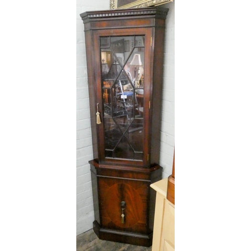 47 - A reproduction mahogany part glazed corner display cabinet with cupboard under