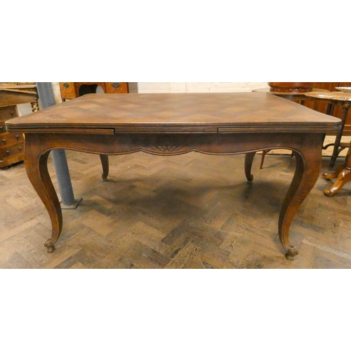 248 - A French oak parquetry topped draw leaf dining table standing on cabriole legs