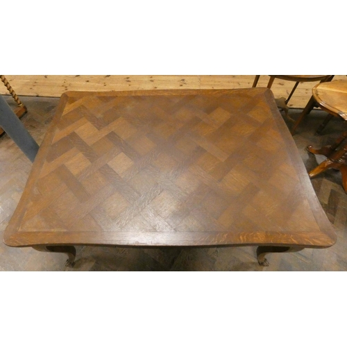 248 - A French oak parquetry topped draw leaf dining table standing on cabriole legs