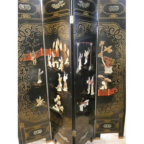 254 - A Chinese black lacquered four fold draft screen with soapstone figure panels