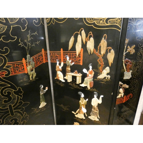 254 - A Chinese black lacquered four fold draft screen with soapstone figure panels