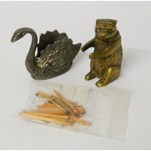 453 - A novelty brass Bear vesta/match striker and a Swan shaped match striker