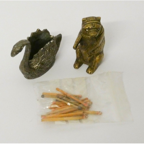 453 - A novelty brass Bear vesta/match striker and a Swan shaped match striker