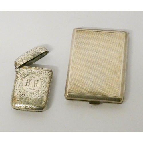 465 - A silver engine turned match case and a silver engraved vesta case