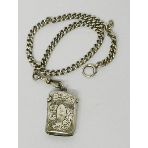 469 - A silver watch Albert chain with attached silver vesta. Gross weight 1.4 troy oz.