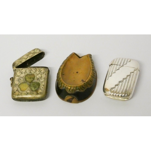 470 - Shamrock decorated vesta case, a brass horseshoe shaped vesta and a silver plated vesta engraved The... 