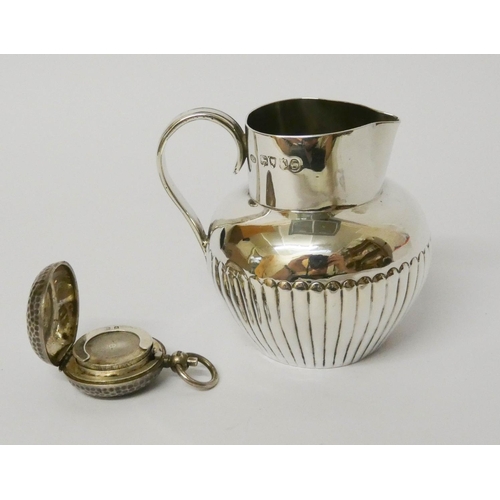 473 - Victorian silver cream jug of half lobed form, London 1885, and a silver sovereign case, gross weigh... 