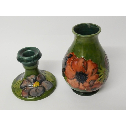 488 - Moorcroft - a circular candlestick and a vase decorated with Anemones on a green ground. Vase 14 cms... 