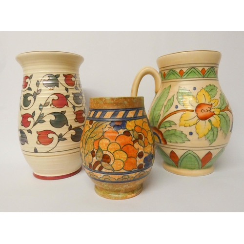 489 - Crown Ducal - three pieces - a ribbed vase, tube lined Art Deco vase and a large jug. Tallest piece ... 