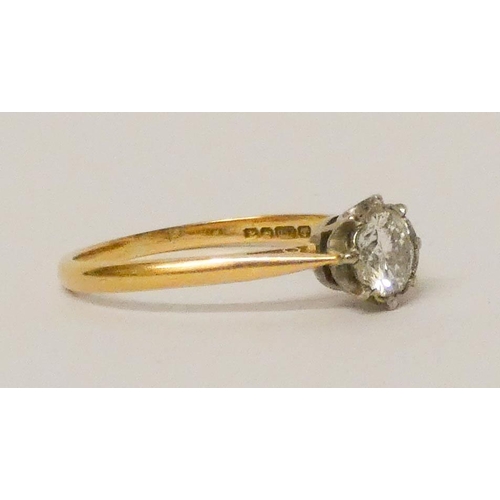 629 - Solitaire diamond ring, set with a claw set brilliant cut diamond of approximately 0.7 carats on 18c... 