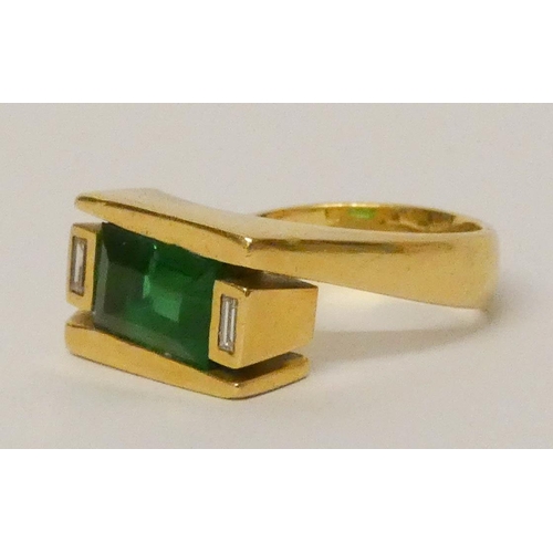 677 - An 18ct gold modern signet style dress ring, set diamonds and a green stone, hallmarked 18t yellow g... 