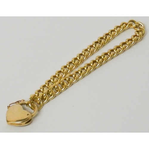 678 - A 9ct yellow gold curb chain bracelet, with CZ set heart shaped fastening, heart marked 9kt. 10 gram... 