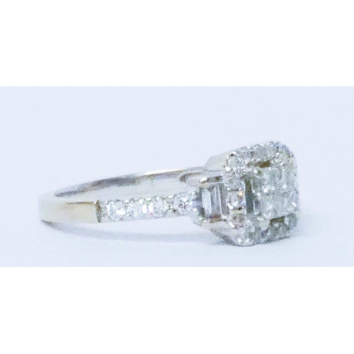 679 - 18ct white gold modern diamond cluster ring, with a central square pave panel to stepped diamond sho... 